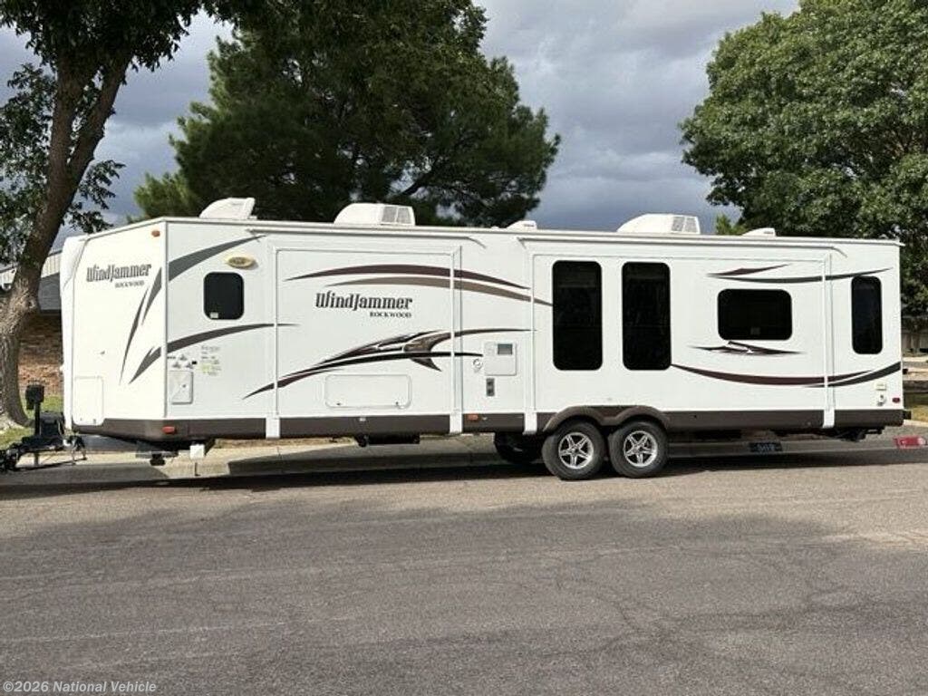 Used 2014  Forest River Rockwood Windjammer 3025W by Forest River from National Vehicle in Hobbs, NM