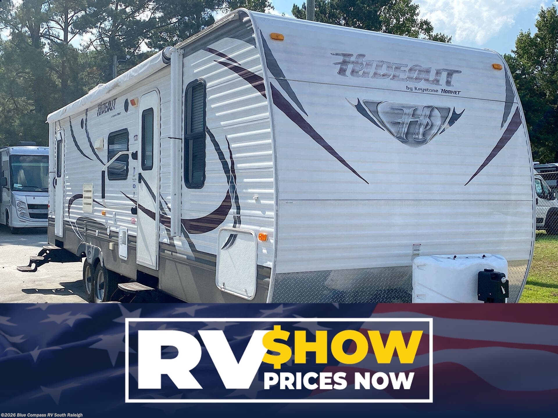 Used 2013  Keystone Hornet Hideout 28BHS by Keystone from Blue Compass RV South Raleigh in Benson, NC